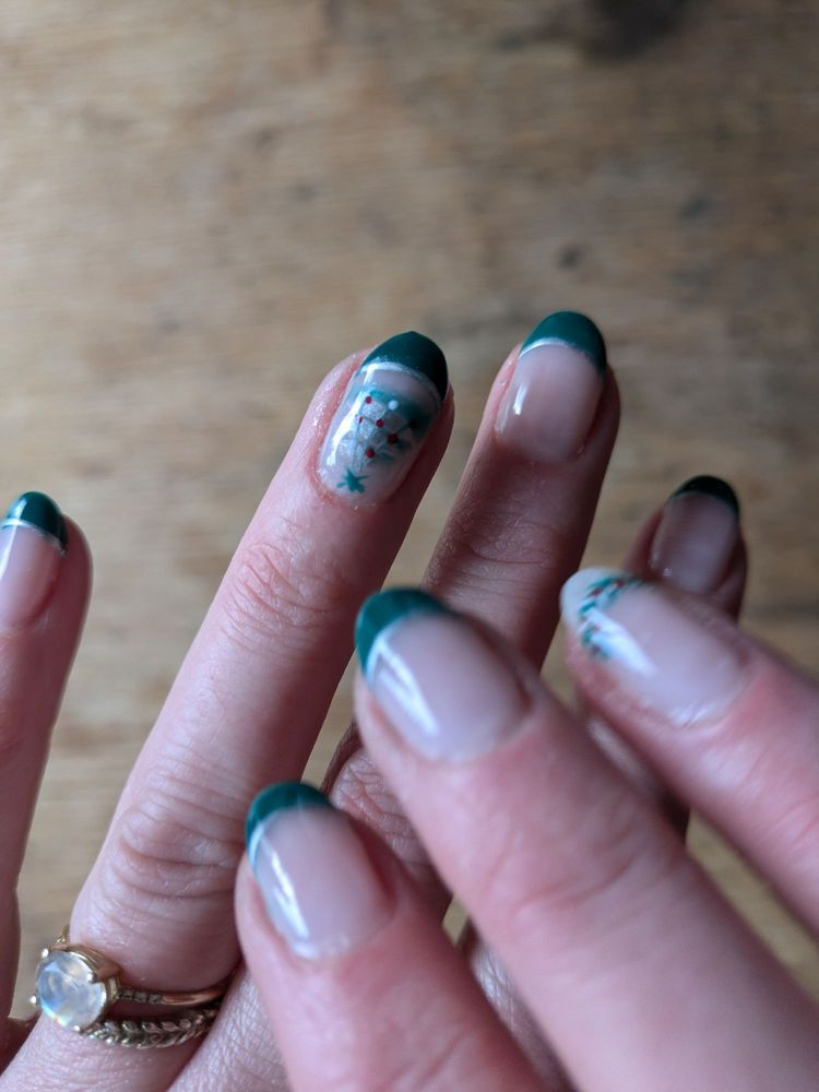 Green French manicure with red and gold floral nail art at T Nails & Spa, Seattle