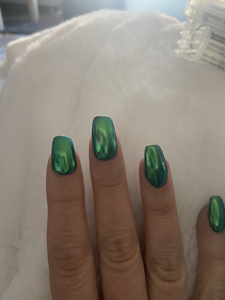 Mirror-finish metallic green chrome gel nails from T Nails & Spa, Seattle